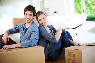 Man and Woman Unpacking boxes