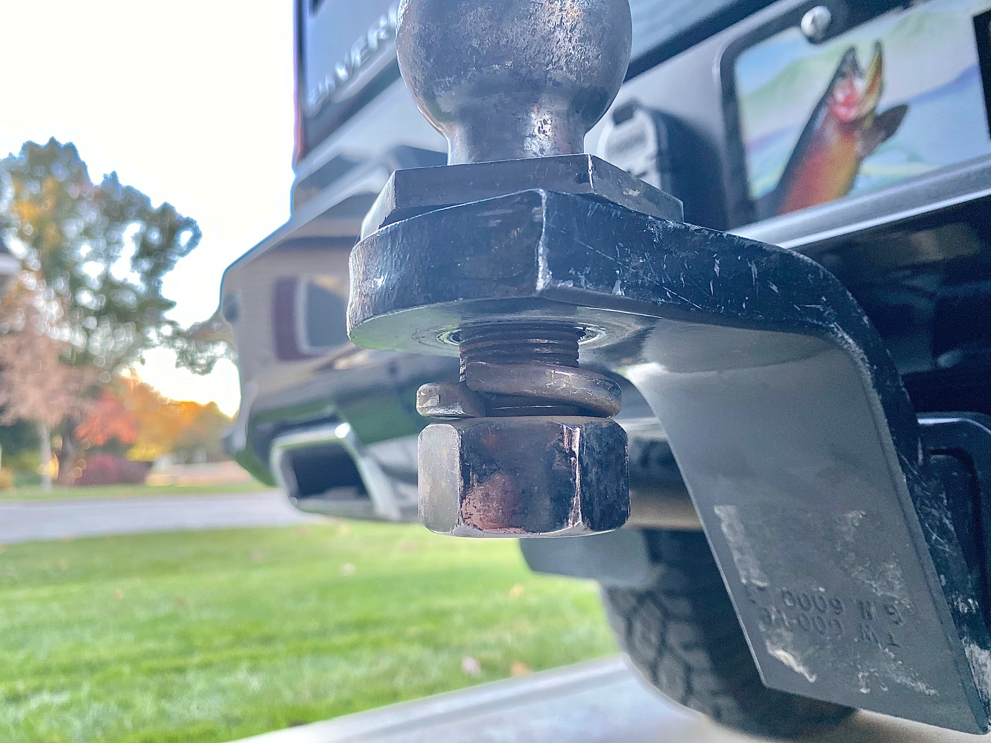 Trailer hitch with ball almost coming off due to a lose nut and bolt.  Trailer Safety suggestions by the Miller Insurance Agency - Everett Washington