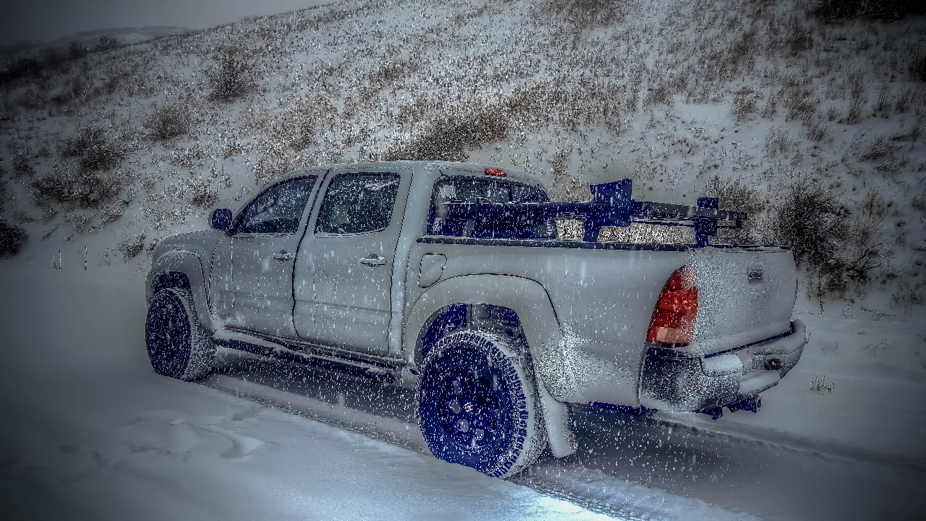 Gray toyota tacoma on a snowy road