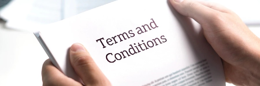 Hands holding paper that read Terms and Conditions